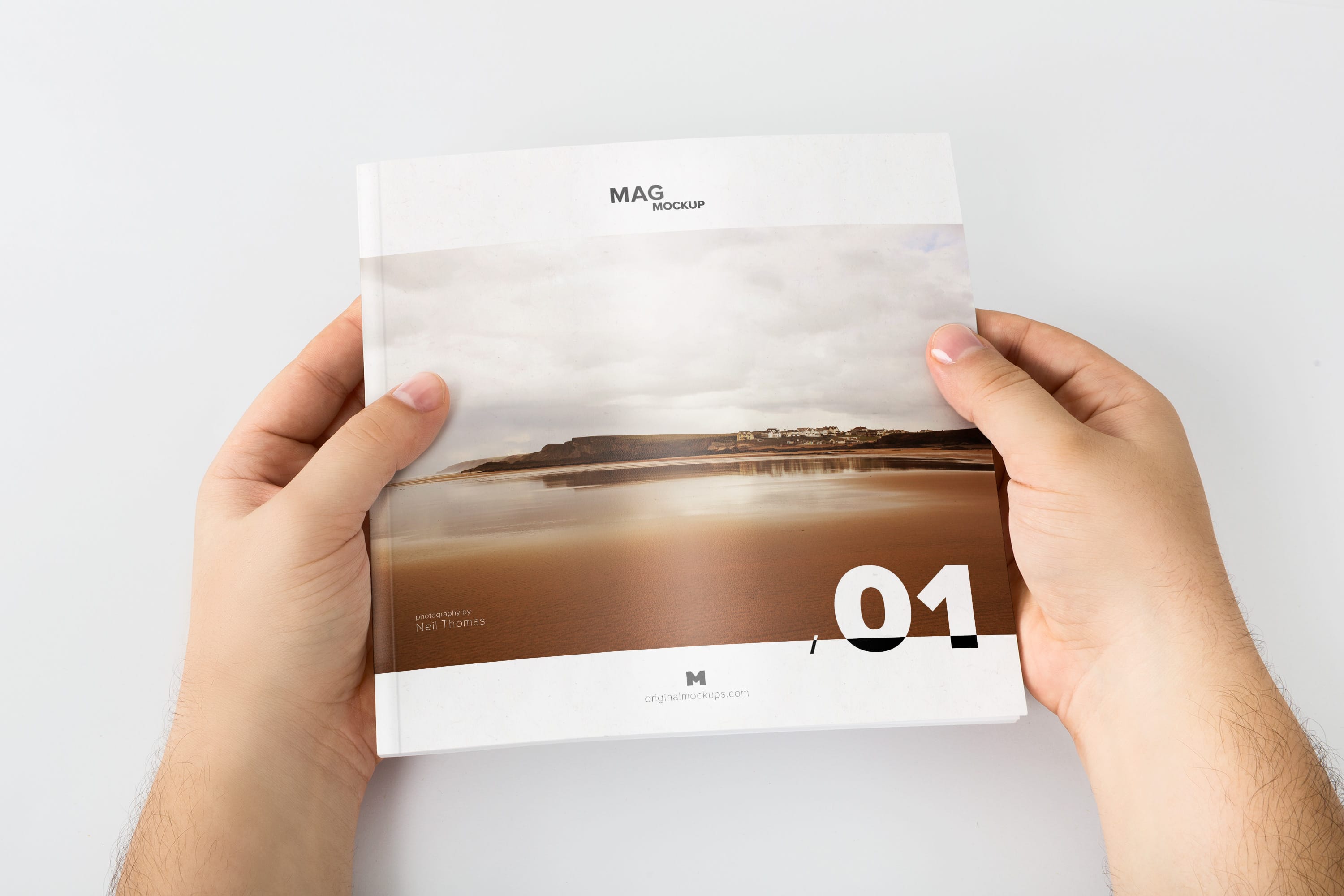 手持场景杂志封面设计样机02 Holding Closed Square Magazine Mockup 02